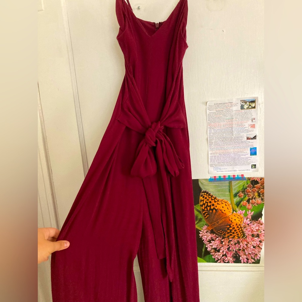 Red/maroon spaghetti strap jumpsuit with ribbon tie in front